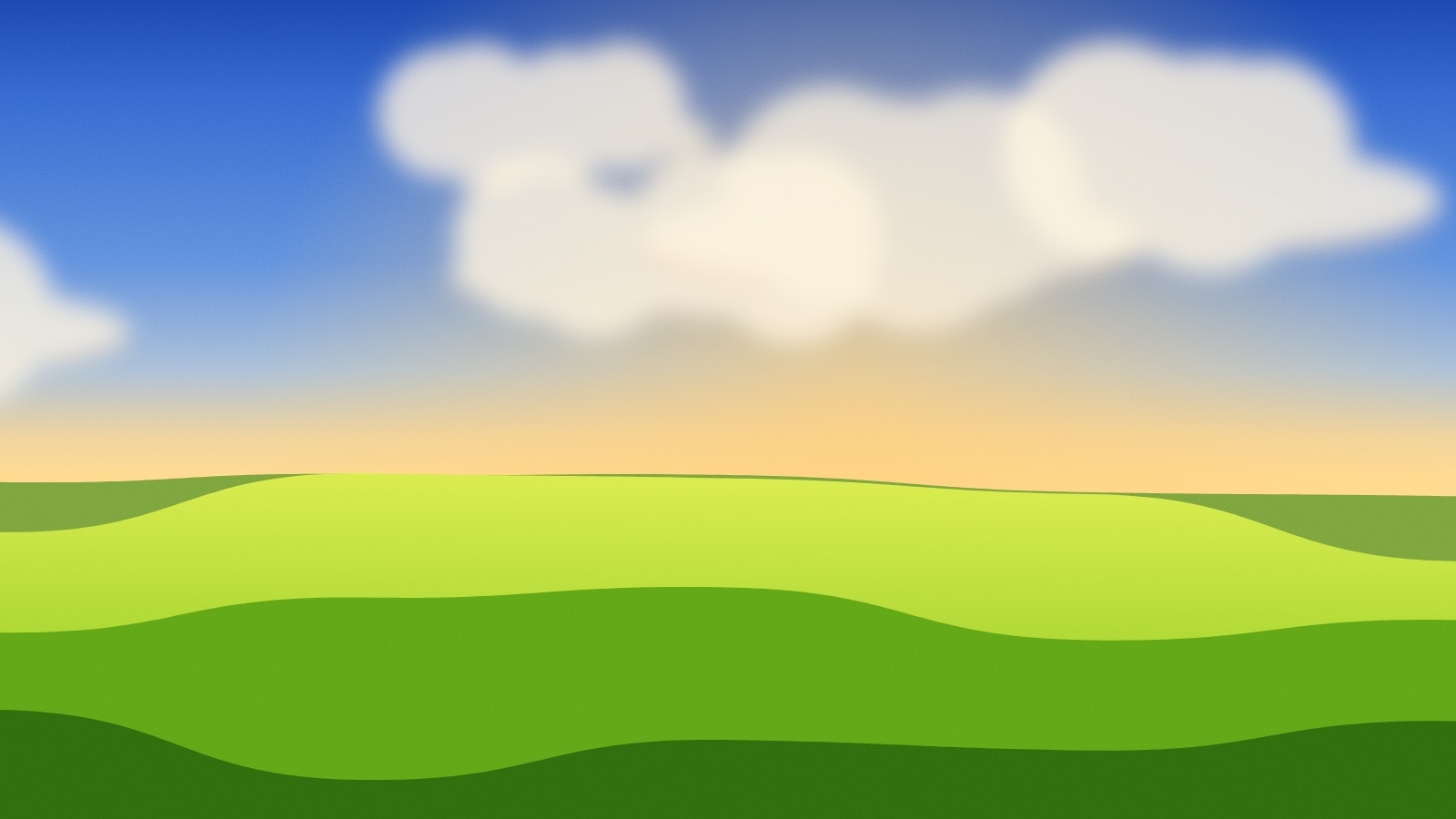 Late afternoon: a gold haze at the horizon, warm clouds and a bright green field.